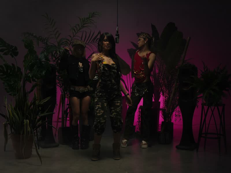 V# and crew on the pink-lit session floor